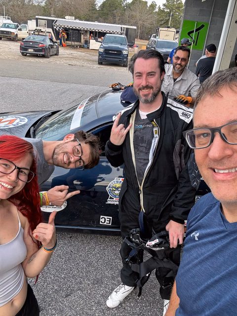 The Plan Z Motorsports team posing with the 2007 Nissan 350Z