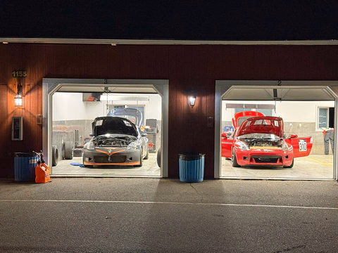 The Nissan 370Z and 350Z cars together in the garage